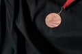 Bronze medal on black background