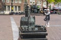 A bronze miniature of the town hall and part of the city stands in front of the real town hall in the city of Middelburg