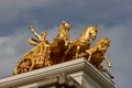 Bronze monument on roof background