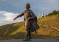 Bronze monument to Yuri Dolgoruky on earthen ramparts background of ancient Kremlin, Dmitrov, Moscow Region, Russia