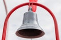 Bronze old bell on red holder in a boat - Close up Royalty Free Stock Photo