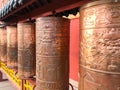 Bronze prayer wheels, spinning Buddhist prayer drums at The Putuo Zongcheng Buddhist Temple