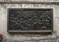 Bronze relief in Hoa Lo Prison, commemorating turning the prison into a school to propagate the revolutionary argument