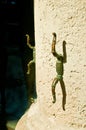 bronze rope security tie, attached to a concrete column