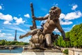 Bronze sculpture on the Bridge Pont Alexandre III and Eiffel Tower in the behind in Paris, France Royalty Free Stock Photo