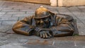 Bronze sculpture called Cumil -The Watcher, or Man at work, Bratislava, Slovakia Royalty Free Stock Photo