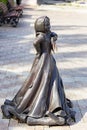 bronze sculpture of a dancing little girl in a sundress in the P.P. Bazhova on a summer day