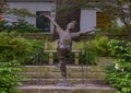 Bronze sculpture of an enthusiastic child by Gary Price at the Dallas Arboretum and Botanical Garden