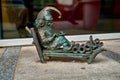 Bronze sculpture of fairy-tale gnome Google dwarf in Wroclaw Poland