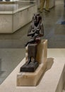 Bronze sculpture of the goddess Isis nursing her son Horus on display in the NMEC in Cairo, Egypt.