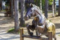 A bronze sculpture of a horse jumping over a barrier in the P.P. Bazhova on a summer day