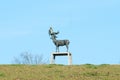 Bronze sculpture `Man in deer antlers` by Stephan Balkenhol. Sculpture on art path in Ratingen, Germany