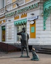 Bronze sculpture of a policeman with a dog in the historical center of Omsk in summer