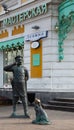 Bronze sculpture of a policeman with a dog in the historical center of Omsk in summer