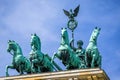 The bronze sculpture Quadriga on top of the Brandenburg Gate in Berlin, Germany