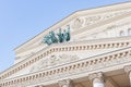 Bronze sculpture of a rider in a chariot drawn by four horses on the facade of the Bolshoi Theater in Moscow Royalty Free Stock Photo