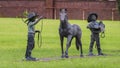 Bronze sculpture with a small horse and boys as cowboys in Southlake, Texas.
