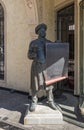 Bronze sculpture of a standing chef with a menu in his hands on Ioane Shavteli St in Tbilisi city in Georgia