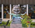 Bronze sculpture titled `Humpty Dumpty - Eggcitement` by Kimber Fiebiger at the Richardson Library Reading Garden.