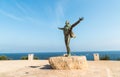 Bronze sculpture to Domenico Modugno, Italian musician and politician, on the seafront in Polignano a Mare, Puglia