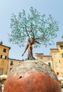 Bronze sculpture of the Tree of Life in the Amphitheater square in old town Lucca, Tuscany, Italy