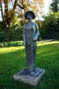 The bronze sculpture `Vietnamese mother with child` stands at the entrance to the castle island `Schlossinsel` of KÃÂ¶penick.