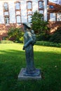 The bronze sculpture `Vietnamese mother with child` stands at the entrance to the castle island `Schlossinsel` of KÃÂ¶penick.