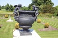 Bronze sculptured urn at a topiary garden Royalty Free Stock Photo