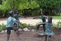 Bronze sculptures of four children playing in a circle at Rotary Botanic Gardens in Janesville, Wisconsin