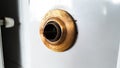 Bronze shining door knob broken on gray metal door Royalty Free Stock Photo