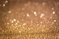 Bronze shiny glitter texture. Selective focus. Glowing surface, sparkle lights and bokeh effects. Christmas and festive Royalty Free Stock Photo