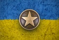 Bronze star on Ukraine flag background Royalty Free Stock Photo