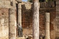 Bronze statue of the actress Margarita Xirgu between columns of the Roman theater of Merida