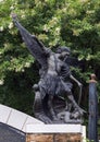 Bronze statue of the Archangel Saint Michael defeating Lucifer at the Blessed Sacrament Catholic Church in Dallas, Texas.