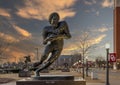 Bronze statue of Billy Sims by sculptor Jim Franklin in Heisman Park on the campus of the University of Oklahoma in Norman. Royalty Free Stock Photo