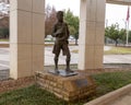 A bronze statue of a Boy Scout stands in front of the Boy Scouts of the USA Circle 10 Council headquarters in Dallas, TX