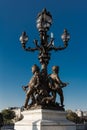 The bronze statue of bridge Alexandre III, Paris, France. Royalty Free Stock Photo