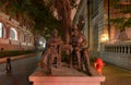 Bronze Statue of Chinese and Europeans traders at the evening, winter, Shamian Island Royalty Free Stock Photo