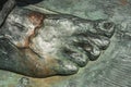 Bronze statue close up of a right male foot