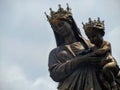 Bronze statue of the crowned Virgin Mary with Christ child in Italy.