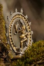 Bronze statue of indian dancing god Shiva Nataraja close up - blurred background