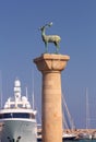 Bronze statue of a deer on a stone column in the harbor of Rhodes.