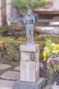 Bronze statue of economist Ninomiya Kinjiro with at its base a japanese sutra and a bronze bell BonshÃÂ