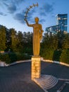 The First Swallows statue at sunset in Vilnius, Lithuania