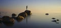 Bronze fisherman over calm sea