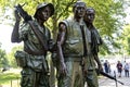 Bronze statue of the Hispanic, Caucasian and African American on the National Mall in Washington DC.