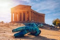 Bronze statue of Icarus in front of the Temple of Concordia at the Valley of the Temples. Temple of Concordia and the statue of Royalty Free Stock Photo