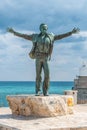 Bronze statue of the Italian singer Domenico Modugno in Polignano a Mare, Bari, Italy