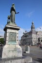 The bronze statue of Jan Pieter Minckeleers with the City Hall Stadhuis in the background Royalty Free Stock Photo