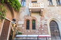 Bronze statue of Juliet and balcony by Juliet house, Verona in Italy Royalty Free Stock Photo